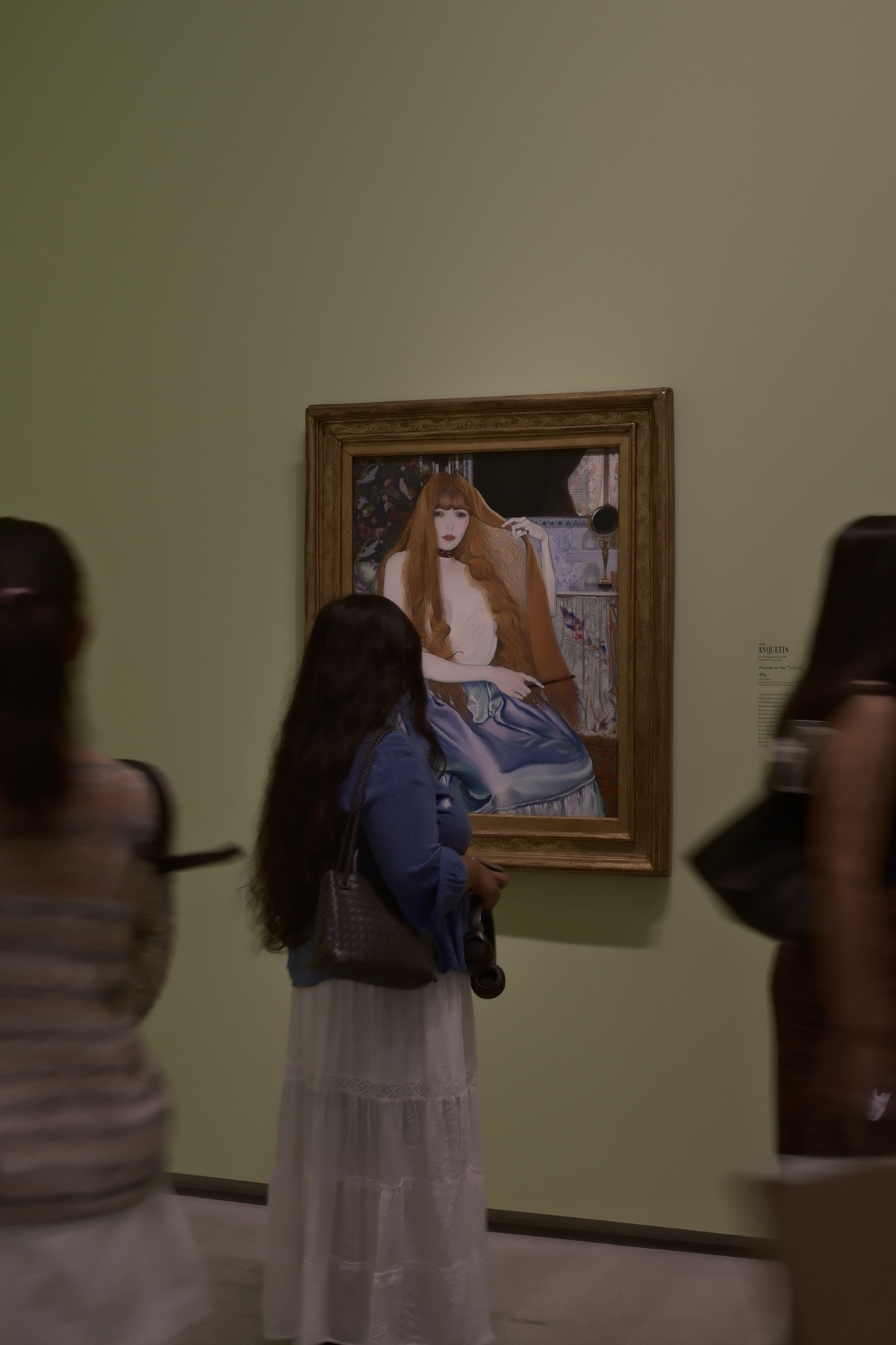 A dark-haired woman before Anquetin's woman with red hair