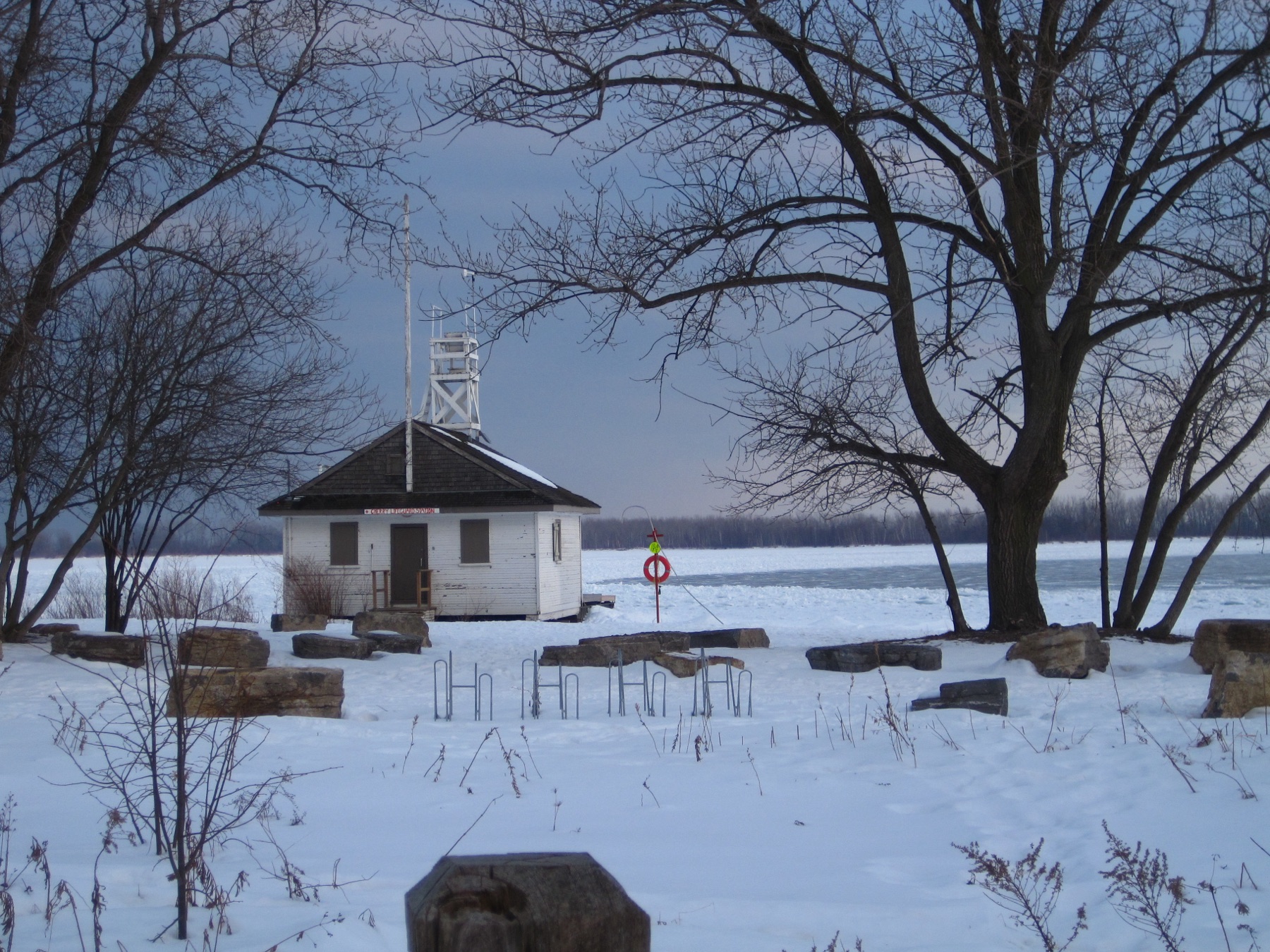 The little white beach hut on the snowy shore