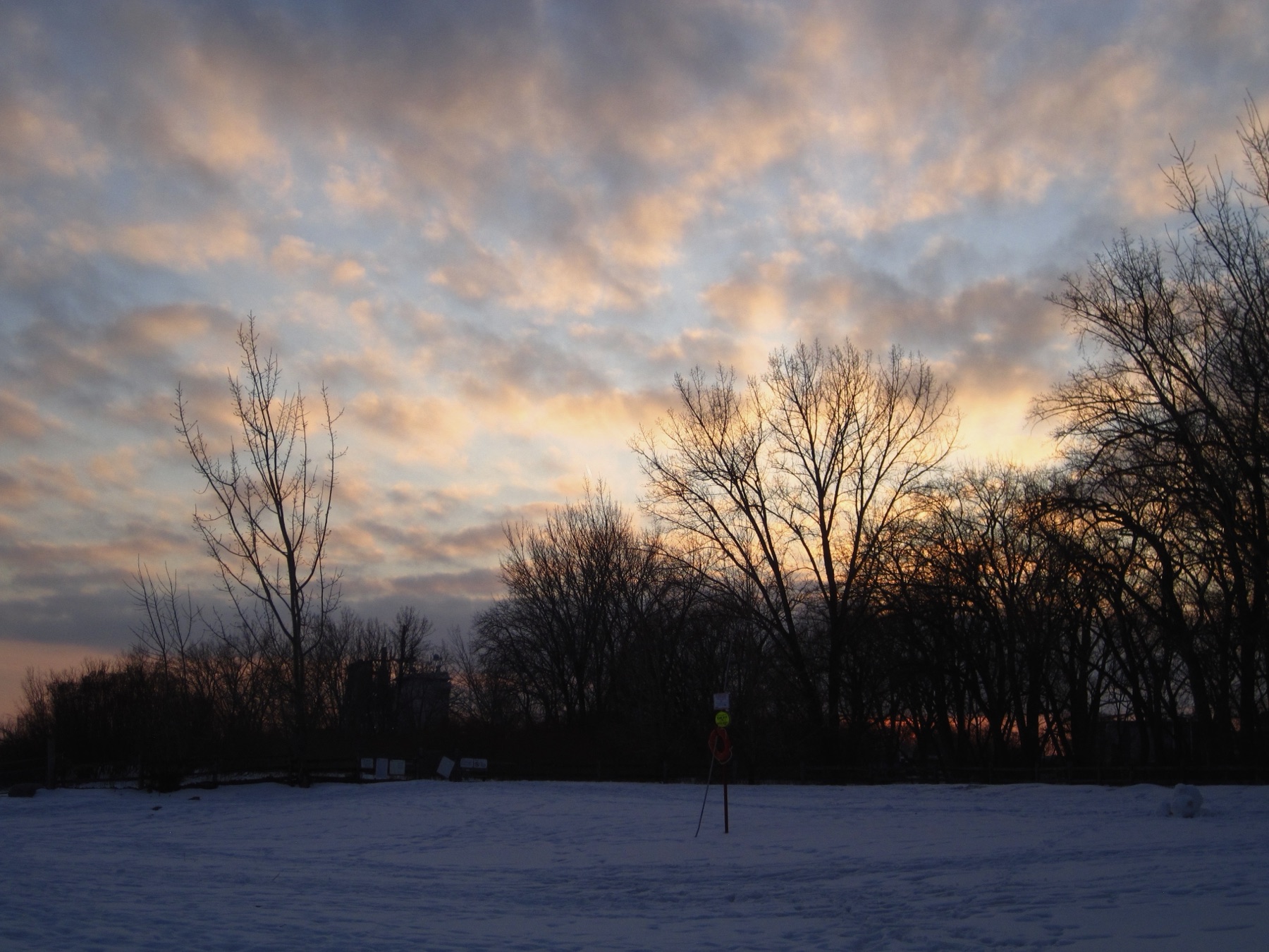 Golden dusk clouds over the frozen Cherry Beach — The Fourteenth at Cherry Beach