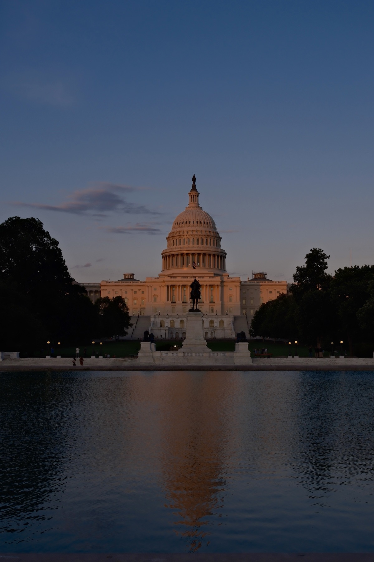 The dome doubled in the reflecting pool — Capitol Hill, Noon to Night