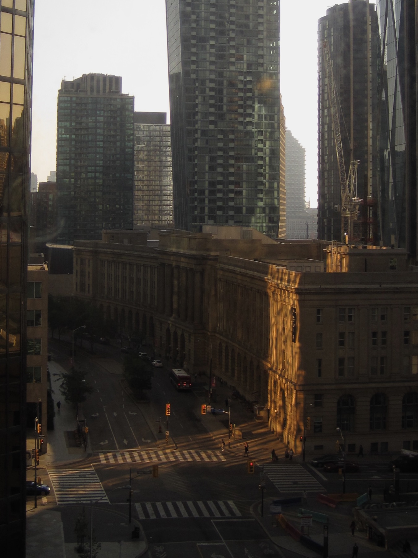 The view down over Front Street, towers behind and old stone buildings catching the low sun