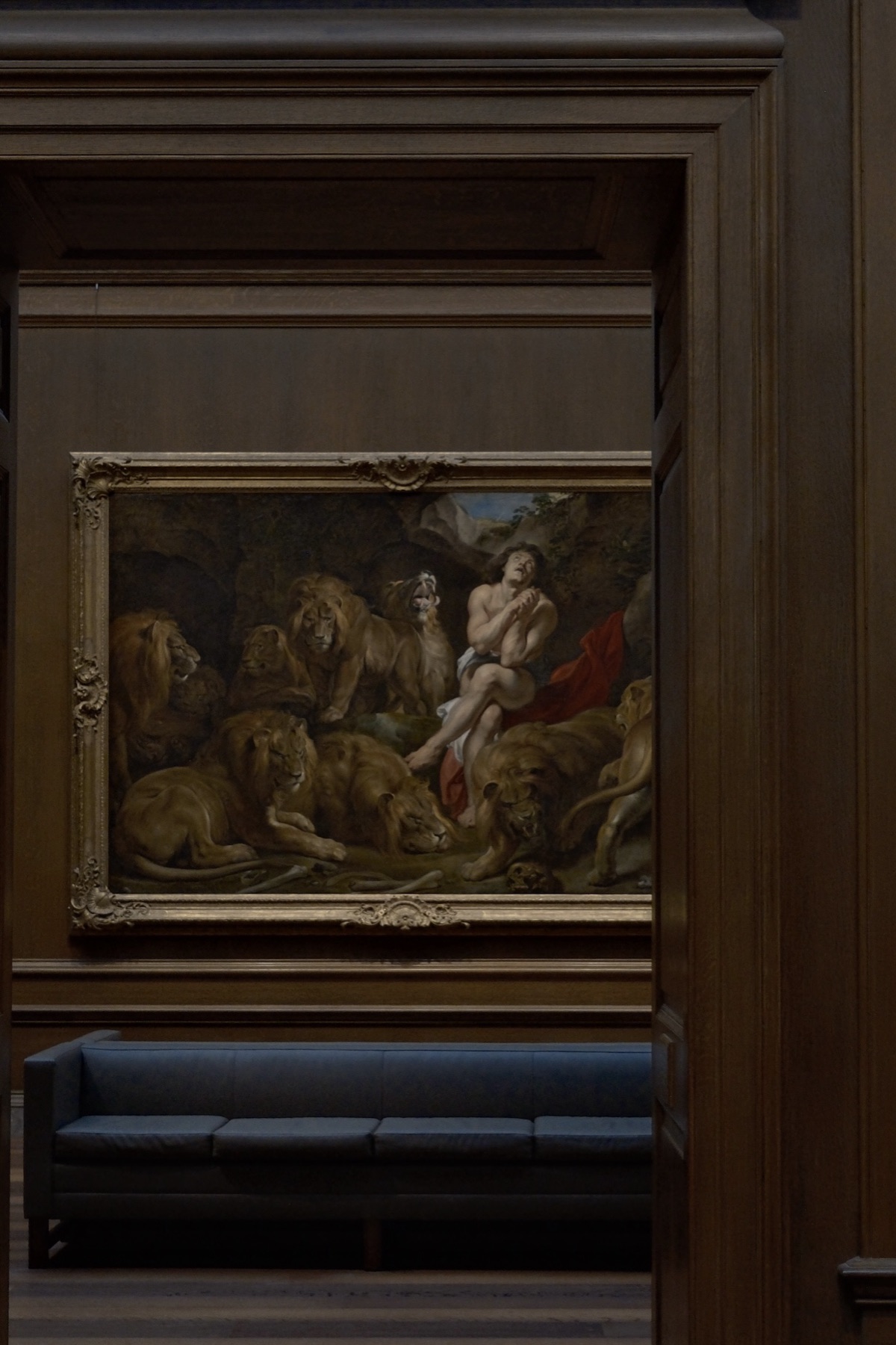 Rubens' Daniel in the Lions' Den in a dark paneled room