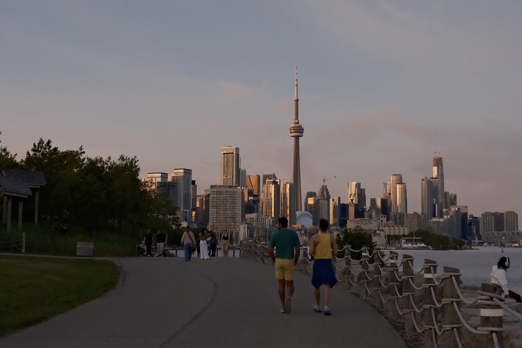 Walkers on the trail, the skyline catching the last gold